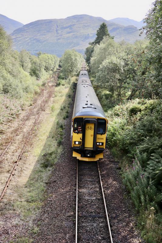 153305 + 156456: On today's 1Y25 from GQS to Oban. Coming down from Crianlarich station. On left is the rump of the former line from Callander. Occasionally used for parking Network Rail track equipment. Photo of 153305 + 156456