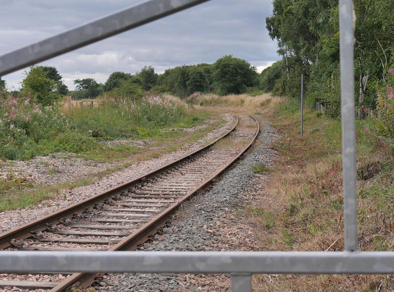 Double Dykes: Looking towards Thornton North Junction from the Double Dykes level crossing. The surviving stub of the Methil branch should prove useful when relaying starts. 31 August 2021. Photo of Double Dykes