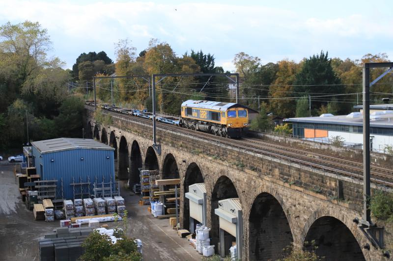 Fresh Air on 4E04: 66708 on 4E04 11.05 Mossend PD Stirling to Doncaster Iport crossing Slateford Viaduct on 22/10/2021. 3 containers near the rear of the train. This would have looked like a light engine from the road. Photo of Fresh Air on 4E04
