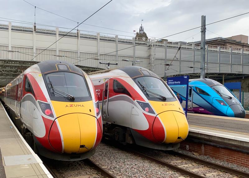 IET Lineup: As TPE's 802208 pulls into Platform 4 of Edinburgh Waverley with a service from Newcastle, Platforms 5 and 6 are occupied by a pair of LNER Class 801 Azumas, preparing to work to London Kings Cross. (11/10/2021) Photo of IET Lineup