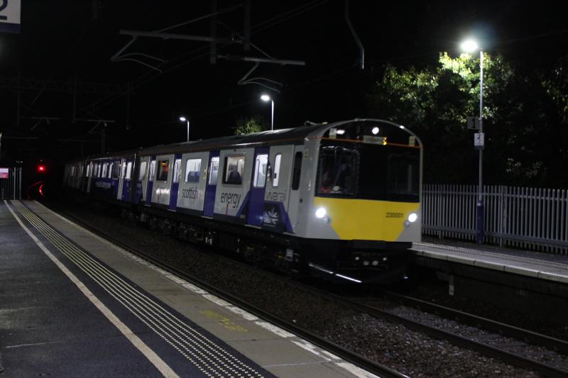 230001: Battery train 230001 slows through Camelon following the 21.57 Falkirk train 29th October 2021. Put in EMU folder as there isn't a battery unit folder, yet. Photo of 230001