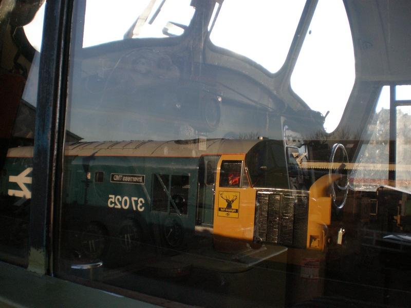 Lets Relfect.: The cab of 37175 with 37025 'Inverness TMD' reflected on the cabside window. Photo of Lets Relfect.