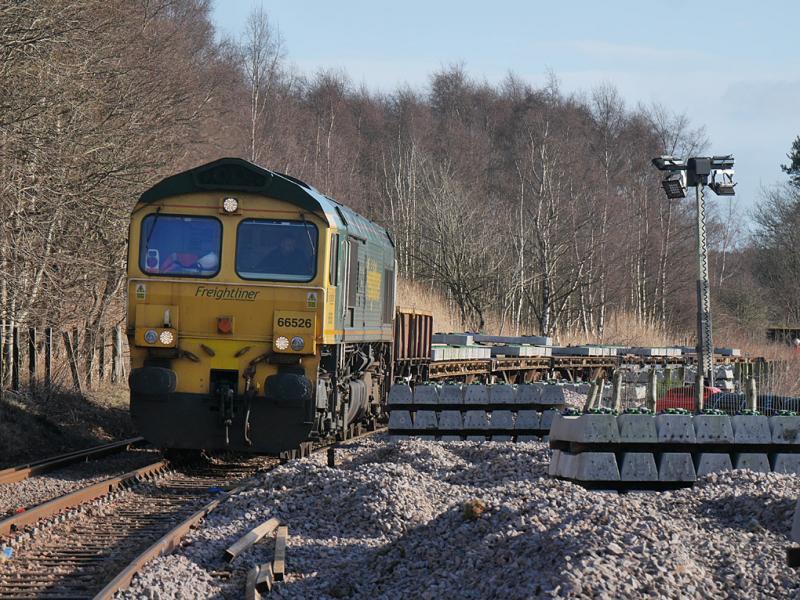 Earlseat delivery: Freightliner 66526 positions wagons at the former Earlseat Loading Pad for offloading concrete sleepers to a new works compound on the Levenmouth branch. 10 February 2022 Photo of Earlseat delivery