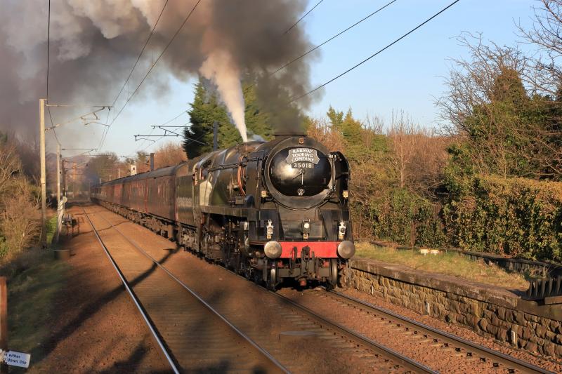 1Z81: 35018 on 1Z81 16.43 Edinburgh to Preston crossing the Union Canal at Kingsknowe on 19/03/2022. Loco accelerating with the safety valve releasing steam. Photo of 1Z81