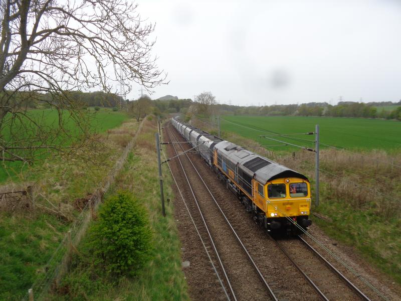 6E32: 66760 with 6E32 diverted aggregates from Mossend passes Kaimes near Kirknewton Photo of 6E32