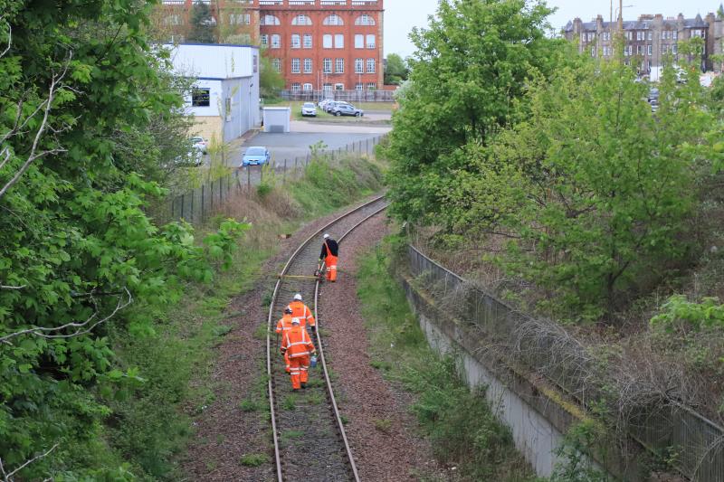 Maintenance: The Leith Branch getting maintenance on Monday 9th May. the small trolley carries a power tool to tighten Bolts. Photo of Maintenance