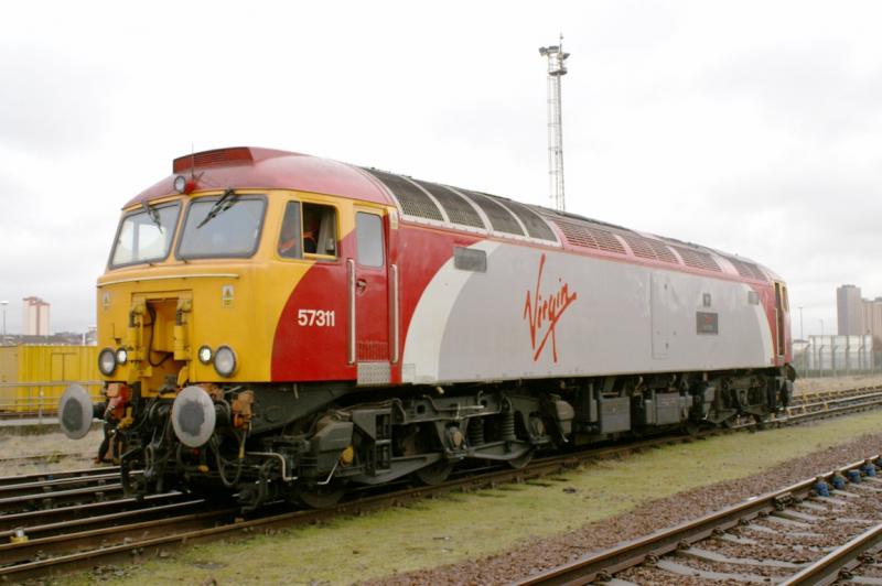 57311: 57311 stands in the yard at Railcare Springburn on 23rd January 2009, with Dellner Couplers removed Photo of 57311