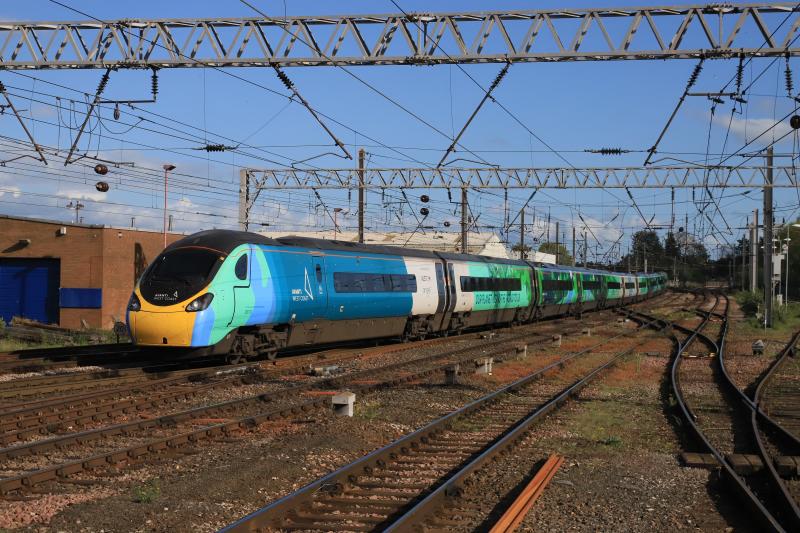 Save The Planet: 390121 on 1M17 16.40 Glasgow Central to Euston leaving Carlisle on 11/05/2022. Ride against Climate change/ Our Planet means the World to Us vinyls Photo of Save The Planet