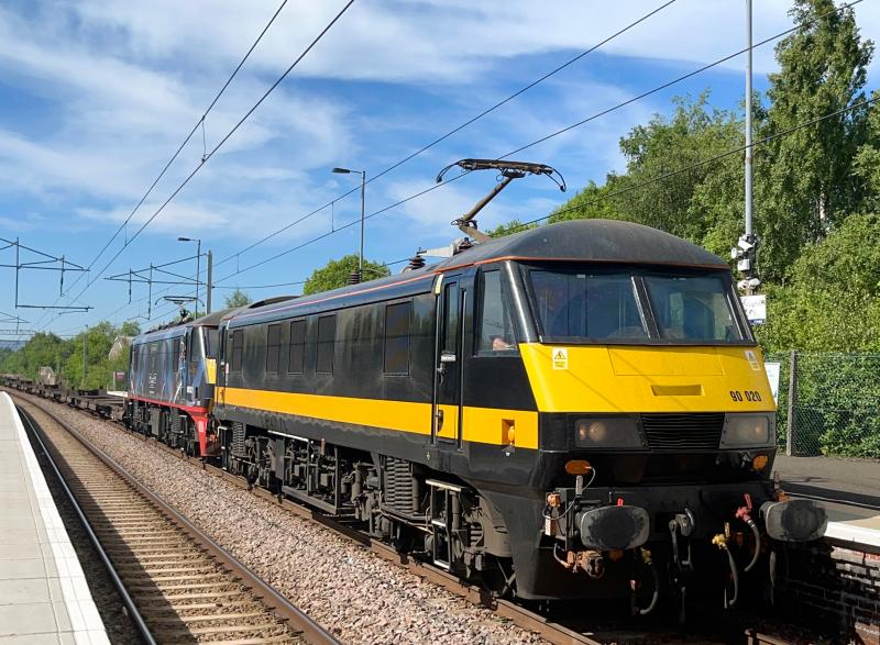 Grand Central Cargo: Debranded Grand Central liveried 90020, with Malcolm 100th anniversary liveried 90021 in tow hauls a load of fresh air through a sunny Coatbridge Central on a mega early 4M30 Grangemouth - Mossend. (05/06/2022) Photo of Grand Central Cargo
