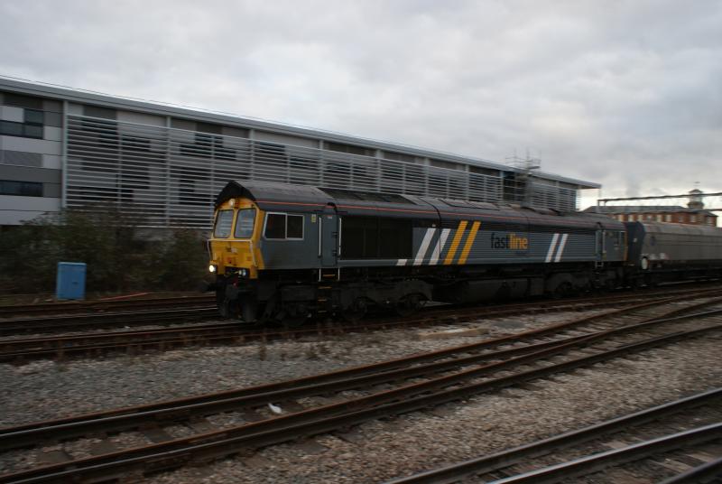 UNUSUAL: FASTLINE 66 No 66303 PASSING BY AT DERBY STATION ON A COLD JANUARY AFTERNOON. Photo of UNUSUAL