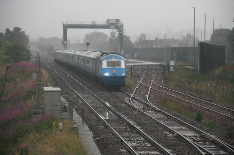 1Z21 at Blackford on 23.07.2022: 43046 leads the blue HST past the Highland Spring Yard at Blackford on 1Z21 the 1557 Aviemore to Crewe in heavy rain Photo of 1Z21 at Blackford on 23.07.2022