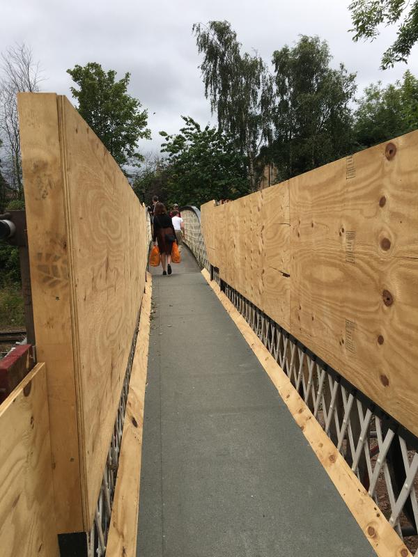 Moray Place Footbridge: The deck of the footbridge, with ramps covering the steps, to allow cycles to use it. Photo of Moray Place Footbridge