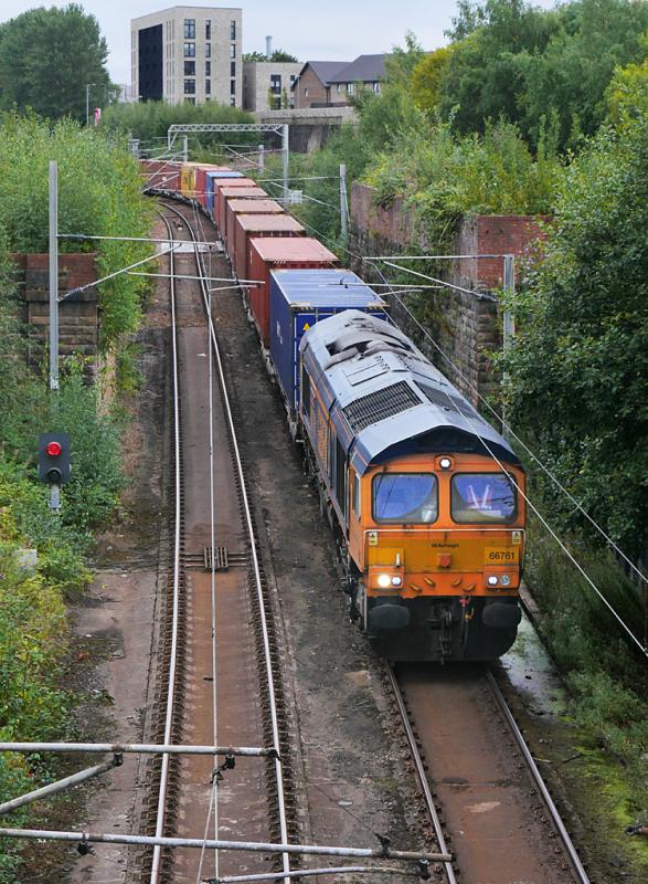 Larkfield 66: 66761 passes Larkfield Junction with a Tees - Elderslie container train. The bridge abutments are from the former main line into St Enoch. 2 September Photo of Larkfield 66