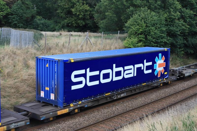Container: Stobart Container on 4E04 9ft 6ins high Super Heavy yellow triangle on the other end Photo of Container