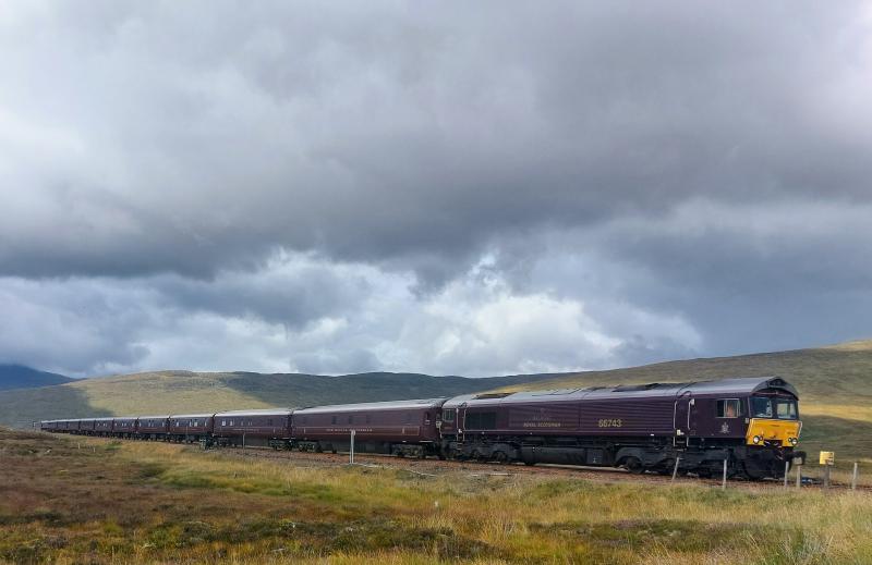 Corrour: 66743 working 1Z88 Royal Scotsman 1230 Fort William -
Oban, reverse at Crianlarich (66746 at rear). Approaching
Corrour 08.09.2022. Photo of Corrour