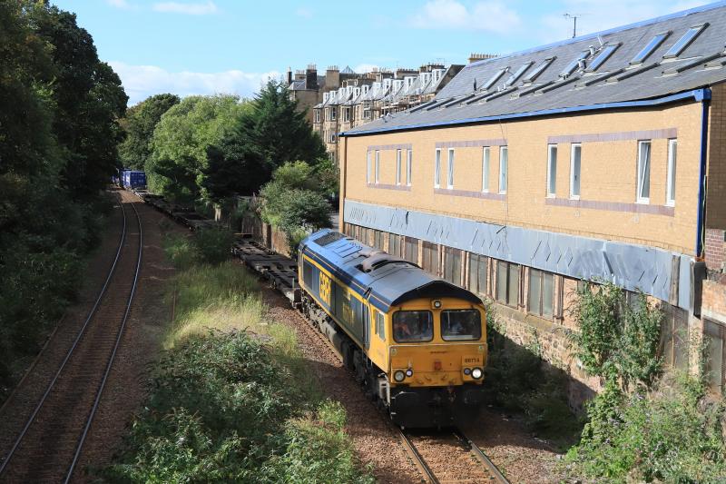 4E04: 66714 on 4E04 11.26 Mossend P.D. Stirling to Doncaster Iport passing the site of Newington Station on 16/09/2022. Containers now visible as only 4 twins are empty Photo of 4E04