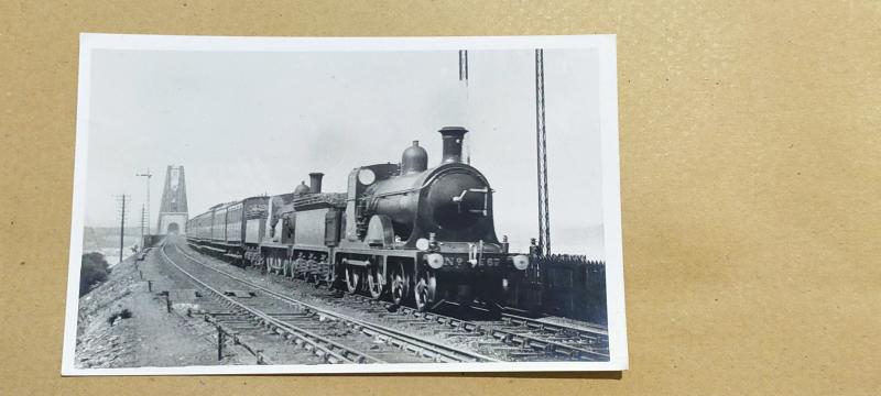 Steam Locos coming of the Forth Bridge: Bought this photo at a preserved Railway about 10 years ago, No information other than it says Forth Bridge on the back.... No Photographer mentioned either.... Photo of Steam Locos coming of the Forth Bridge
