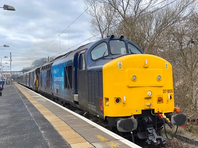 Next in Line: After dropping off the refurbished 318252 back at Yoker, ROG liveried 37800 takes the next unit to be overhauled at Broadies, that being 318255. Seen here powering through Garscadden as the 5Q08 from Yoker CS. (27/02/2023) Photo of Next in Line