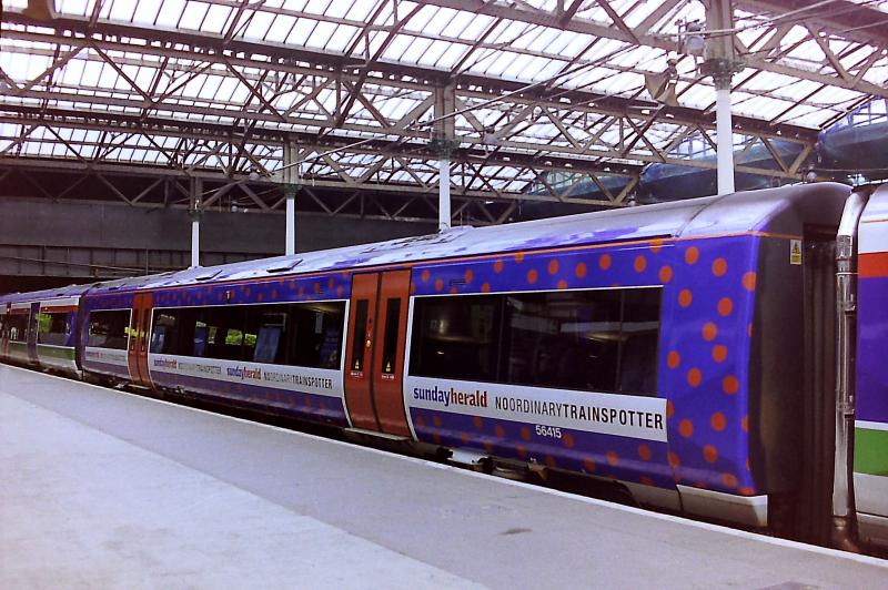 170415 centre car: Advertising liveried 170415 seen at Edinburgh Waverley on 30th May 2000 Photo of 170415 centre car