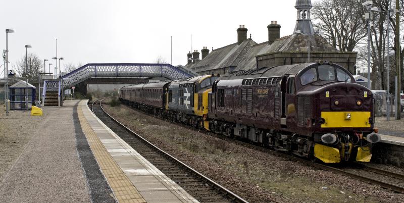 37676 AND 37403 INVERURIE 26.3.23 (1).jpg: RUNNING A FEW MINS LATE THE EXCURSION PASSES SWIFTLY THRO INVERURIE JUST AS THE SNOW STARTED---WELL IT IS SPRING AFTER ALL!! Photo of 37676 AND 37403 INVERURIE 26.3.23 (1).jpg