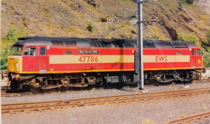Still With Us: 47786 ROY CASTLE OBE (D1730) in EWS livery, stabled at Waverley 24.06.1999. Today with West Coast Railways, different livery, but same identity. Photo of Still With Us