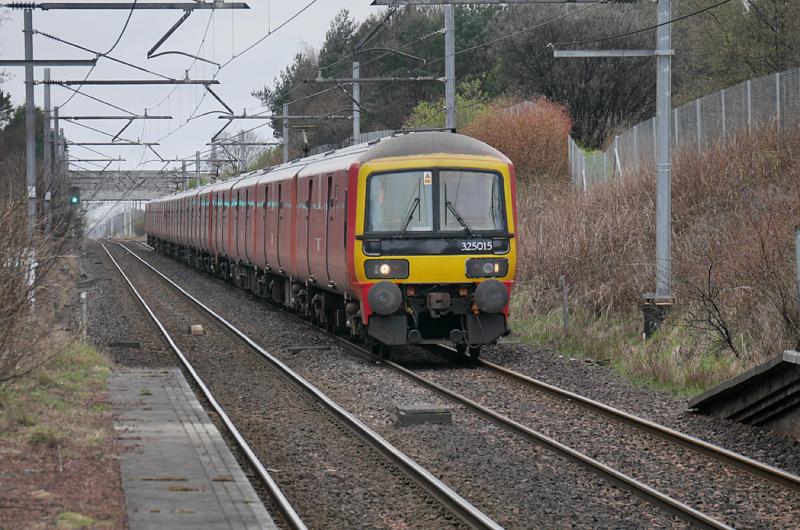 Addiewell Postal: The Shieldmuir - Warrington postal (1M44) formed by 325015, 004 and 008 nears Addiewell, diverted via Midcalder Junction by the Carstairs blockade. Thanks to TractorTroth for the identities. Photo of Addiewell Postal