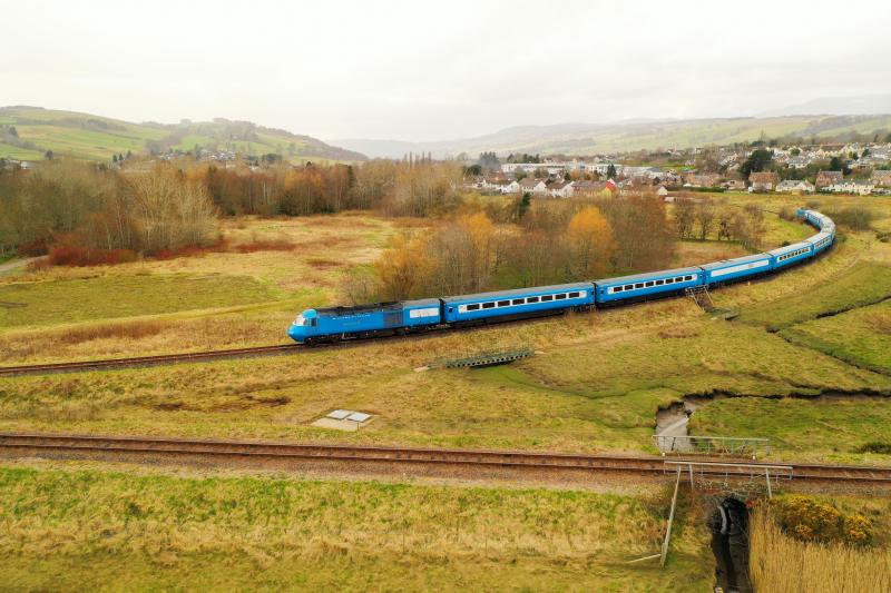 LORD OF THE ISLES PULLMAN.: The Midland Pullman on the approach to the junction at Dingwall on the return from Kyle of Lochalsh. 43046 Geoff Drury 1930-1999 leads with 43055 on rear. The line to the far north in the foreground. Photo of LORD OF THE ISLES PULLMAN.