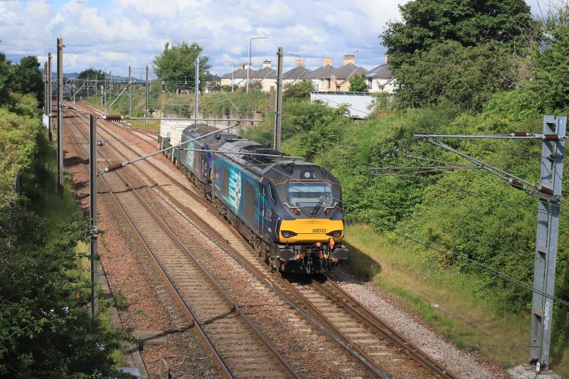 6S43: 68033 + 88007 on 6S43 06.24 Carlisle Kingmoor to Torness Power Stn passing through Prestonpans station on 12/07/2023 Photo of 6S43