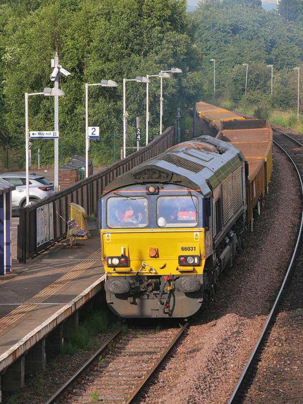 GwT 66: 66031 leads the empty sleeper train through Glenrothes with Thornton heading to Thornton Yard from the Levenmouth branch. 66122 is on the rear. 13 July. Photo of GwT 66