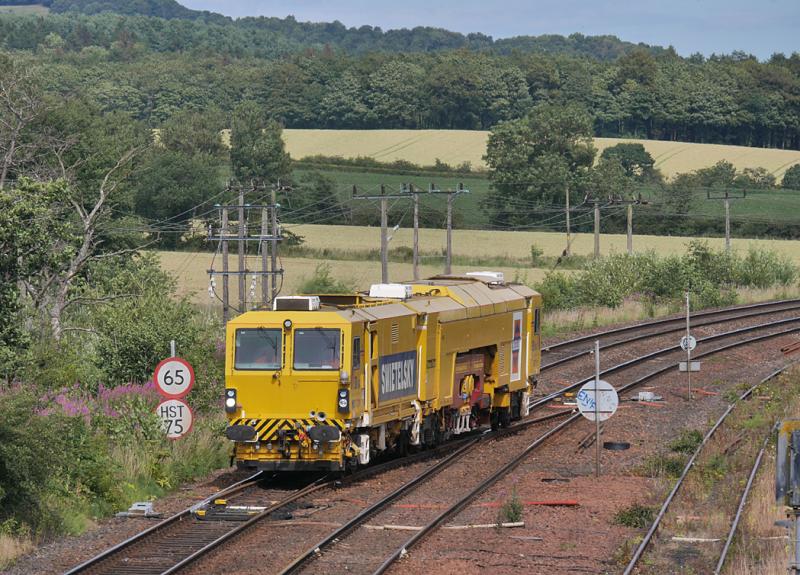 Inverkeithing tamper: DR73111 crosses over at Inverkeithing East Junction to take the chord to North Junction and the Yard. It is returning from duties on the Levenmouth branch. 13 July. Photo of Inverkeithing tamper