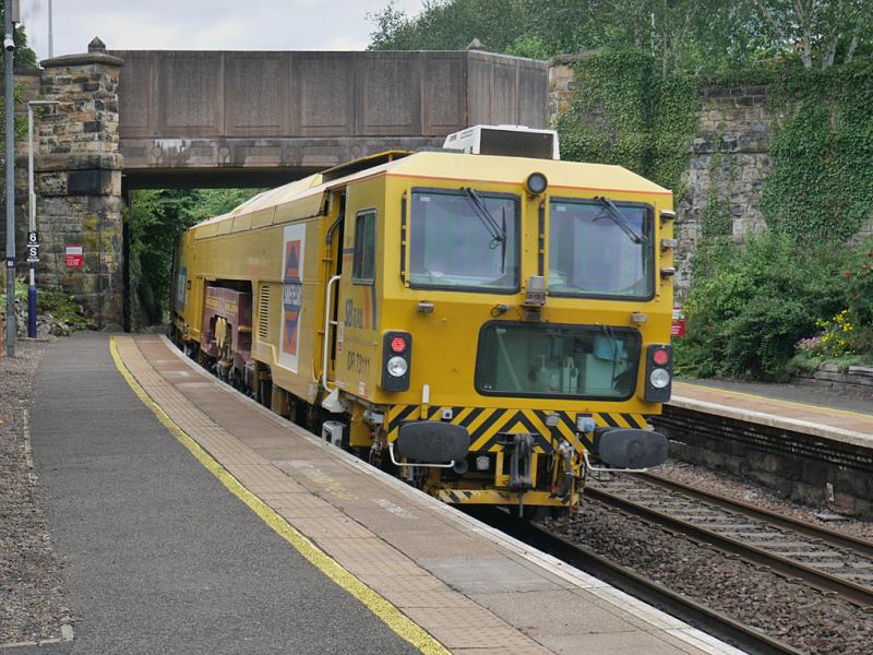Aberdour tamper: SB Rail tamper DR 73111 runs through Aberdour on 10 August, returning from the Levenmouth branch to its base at Inverkeithing Yard. Photo of Aberdour tamper