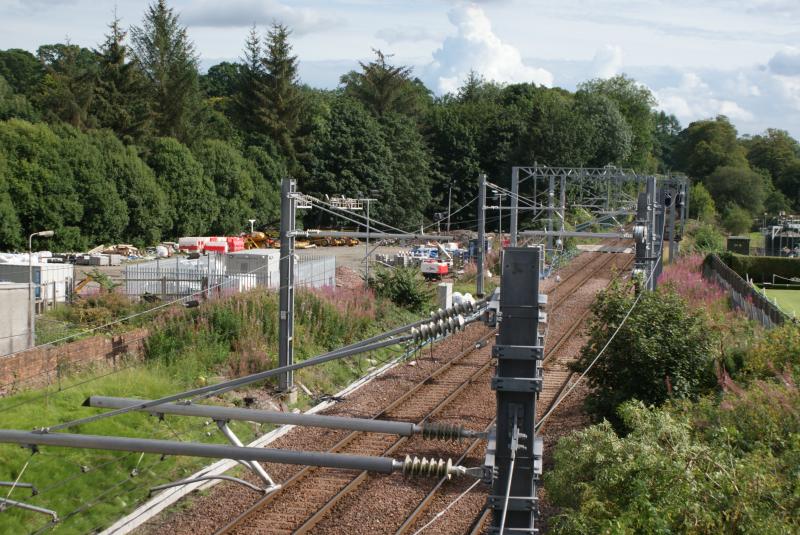 Extra OLE equipment for south crossover at Dunblane: The extra OLE work to provide the new Dunblane south end Down Main to Up Main crossover has been carried out. 14.08.23 Photo of Extra OLE equipment for south crossover at Dunblane