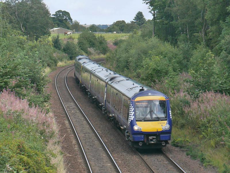 Donibristle 170: 170 394 with 158729 passes the site of Donibristle siding with the 13.24 from Perth to Edinburgh Thanks to the driver for the toot. 16 August. Photo of Donibristle 170