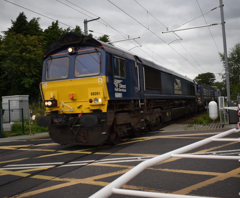 66091 4D47 Cornton Level Crossing 23.8.23: DB 66091 on lease to DRS passes through Cornton Level Crossing with 4D47 on 23.8.23 Photo of 66091 4D47 Cornton Level Crossing 23.8.23