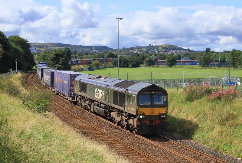 4E04 in the Sun: 66779 on 4E04 11.06 Mossend P.D. Stirling to Doncaster Iport passing Peffermill Playing Fields on 24/08/2023..Sun at last 7th attempt usual clouds appear just before the train appears Photo of 4E04 in the Sun