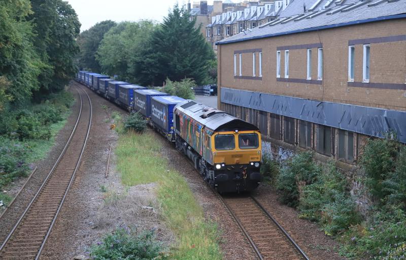 4E04: 66718 on 4E04 11.06 Mossend P.D. Stirling to Doncaster Iport passing the site of Newington Stn on 07/09/2023. Lack of the sun meant there were no dark shadows from the tall trees Photo of 4E04