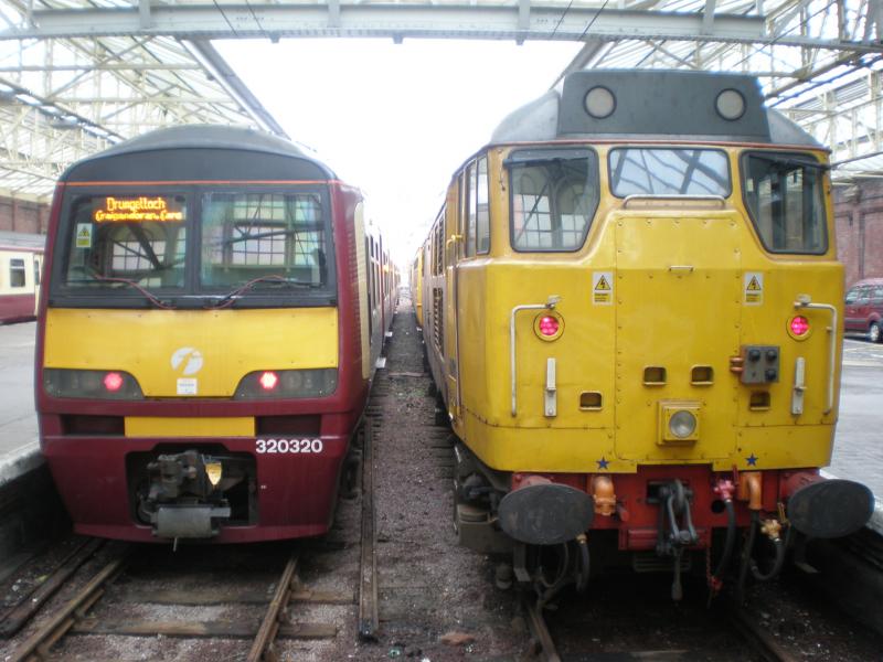 Waiting for the road: 31285, on the GSM-R test train, waits alongside 320320 at Helensburgh Central. Photo of Waiting for the road