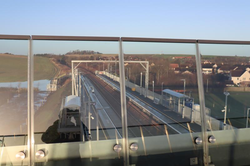 East Linton Station Overbridge: Great to see that glass has been used on the over bridge at East Linton. Visually just looks great and I suspect Security wise it makes sense! Photo of East Linton Station Overbridge