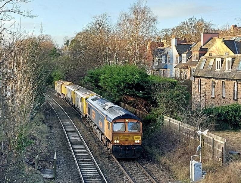 6X69: 66799 Modern Railways Diamond Jubilee heading Schweerbau High Speed Milling Machine Slateford Yard to Domcaster,
passing Blackford (Sub) 19.12.2023. Photo of 6X69