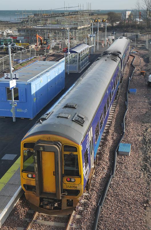 Leven 158 704: 158 704 lays over at Leven between crew training runs. The new station building starts to take shape in the background. Photo of Leven 158 704