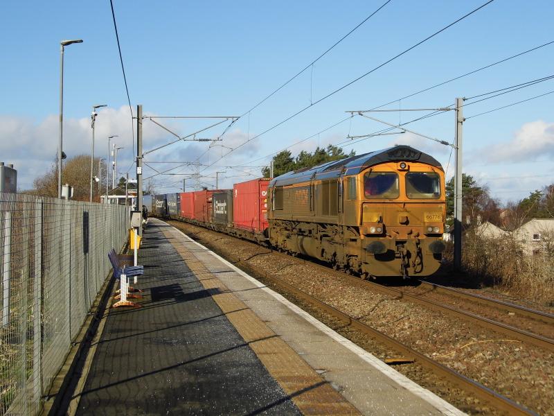 66776 4E04 12/02/2024: Badly in need of a wash after its RHTT duties, 66776 Joanne passes Newcraighall working 4E04 1107 Mossend- Doncaster intermodal on 12/02/2024 Photo of 66776 4E04 12/02/2024