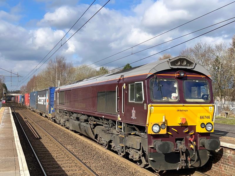 Royal Scotsmodal: Belmond Royal Scotsman livery 66746 commences its journey back to Doncaster Iport with the 4E04 intermodal from Mossend, seen powering through Holytown station in some lovely early Spring sunshine. (06/03/2024) Photo of Royal Scotsmodal