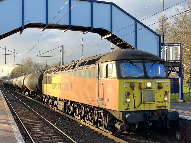 Sinfin Sunset: Colas Rail 56094 takes charge of the 6M80 Grangemouth - Sinfin Sidings aviation tankers, seen in some glorious late evening spring sunshine at Holytown station about to head onto the Shotts line. (07/04/2024) Photo of Sinfin Sunset
