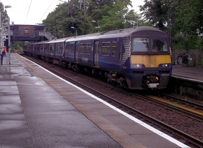320417 at Singer: Scotlands Railway 320417 arrives at Singer with a service to Balloch on 14th June 2024. 318269 is on the rear. Photo of 320417 at Singer
