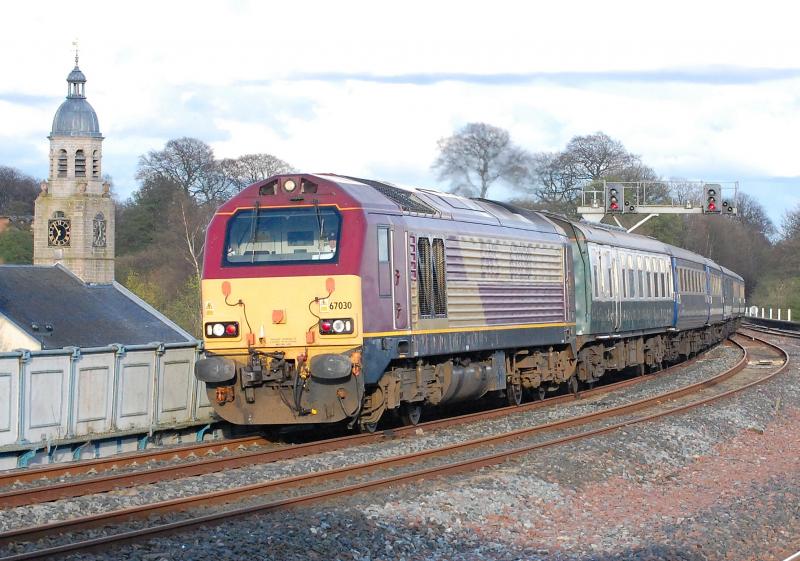 Skip and Spire: 67030 leads 1Z21 Arran & West Highlander railtour past the spire of Kilmarnocks Old High kirk Photo of Skip and Spire