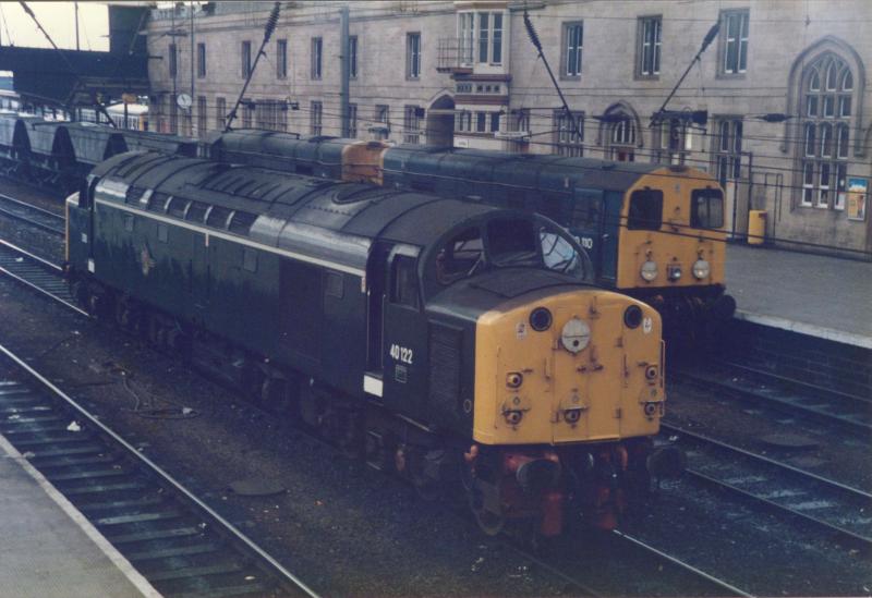40122 rests at Carlisle station: 40122 sitting in the through roads at Carlisle station as a pair of Class 20's power north with an MGR working (summer 1985). Photo of 40122 rests at Carlisle station