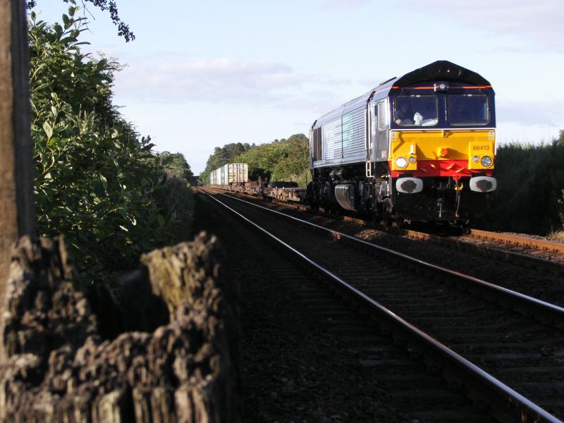 66413 at Ashfield: 66413 heads South past Ashfield on 13 July 2006 with the Aberdeen - Grangemouth Photo of 66413 at Ashfield