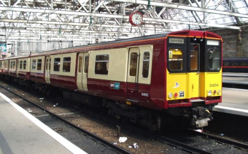 314214 at Glasgow C. 31.Jul.04: 314214 in SPT Carmine and Cream livery (with cream doors and SPT-rail branding) at Glasgow Central, 31 July 2004 Photo of 314214 at Glasgow C. 31.Jul.04