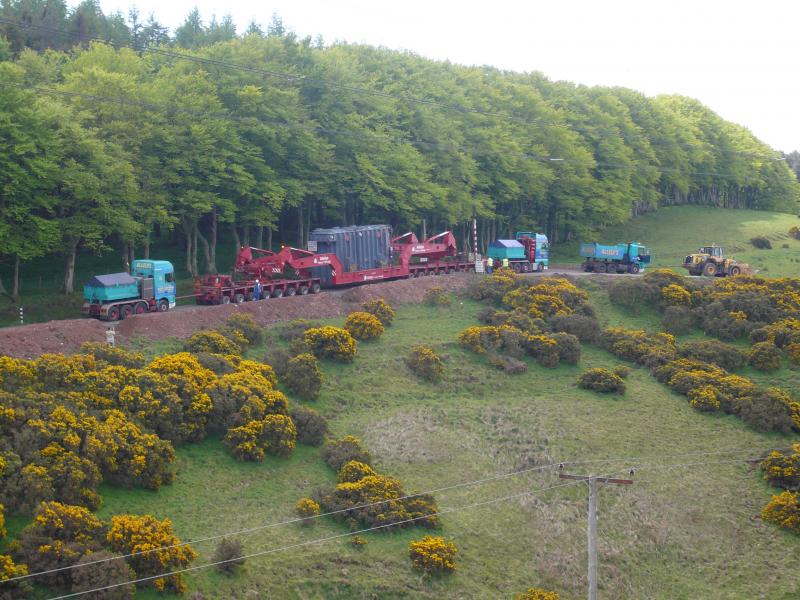 triple header plus banker: 135 ton transformer up a dirt track to Crystal Rigg wind farm in the Lammermuir Hills. With 3 tractors plus bulldozer over 550 tons. Bigger than your average ScotRail train. And even slower! 17 may 09 Photo of triple header plus banker
