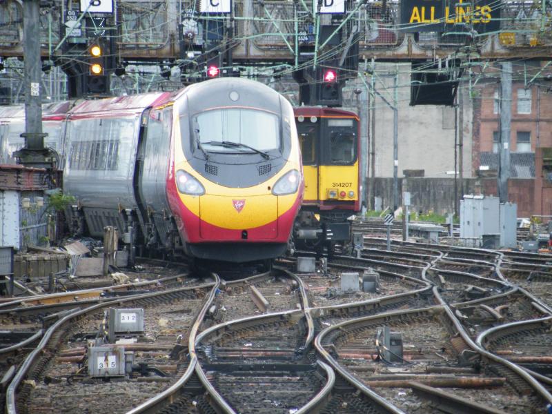 390 044 and 314 207: Both departing from Glasgow central. They look as if they were racing. Photo of 390 044 and 314 207